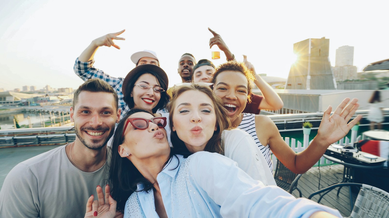 A group of friends sharing a happy rooftop moment